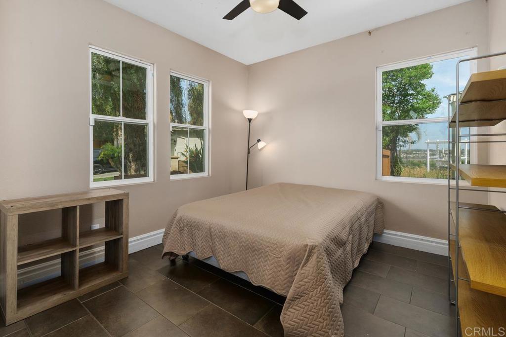 44684 Mumm Street Temecula, CA 92592 - Photo 21 of 51 a bedroom with a bed and a window