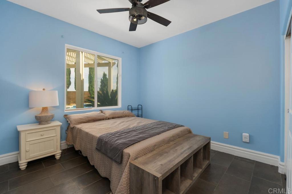 44684 Mumm Street Temecula, CA 92592 - Photo 22 of 51 a bedroom with a bed and window