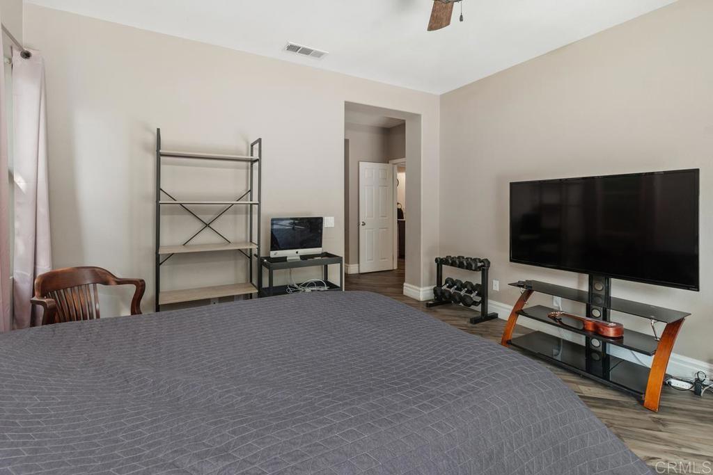 44684 Mumm Street Temecula, CA 92592 - Photo 26 of 51 a living room with furniture and a flat screen tv