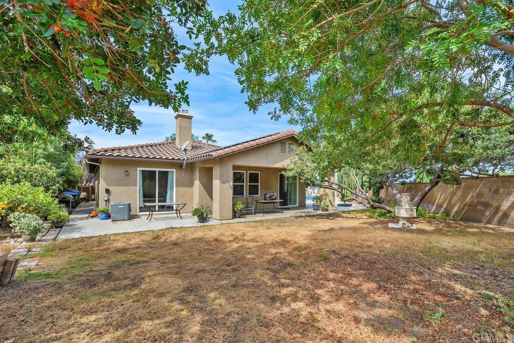 44684 Mumm Street Temecula, CA 92592 - Photo 31 of 51 a front view of a house with a yard and potted plants