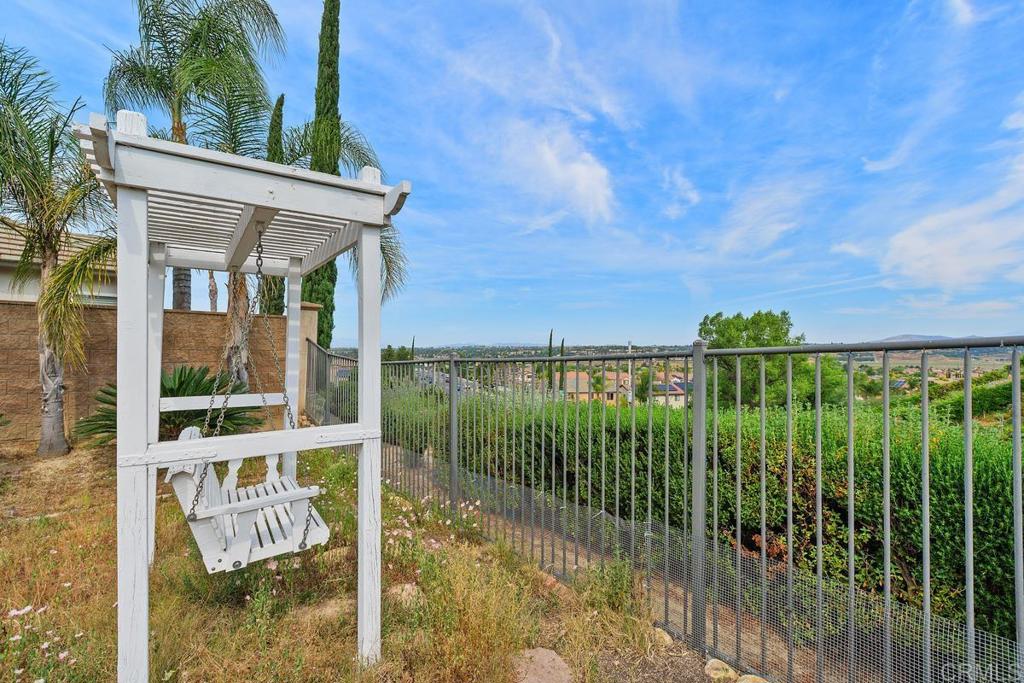 44684 Mumm Street Temecula, CA 92592 - Photo 34 of 51 a view of a porch with a floor to ceiling window