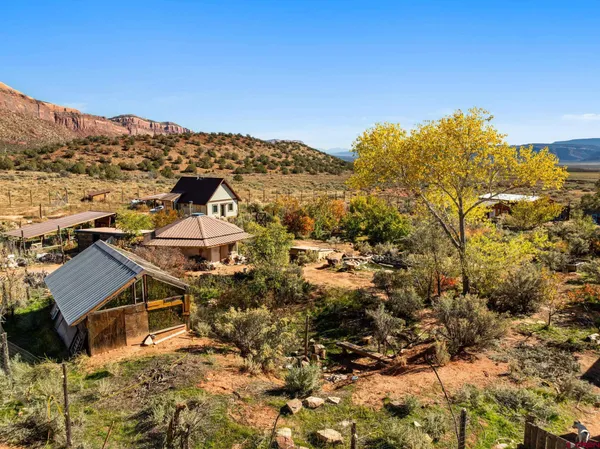 a view of a house with a mountain in the background