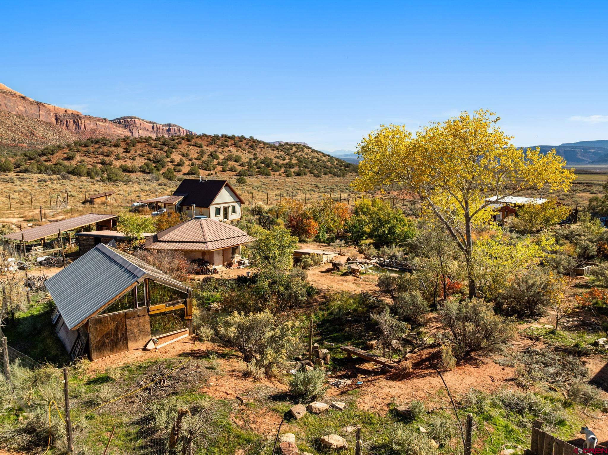 a view of a house with a mountain in the background