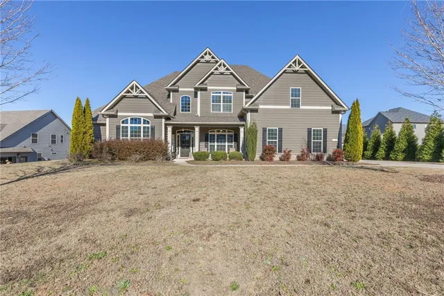 a front view of a house with a yard