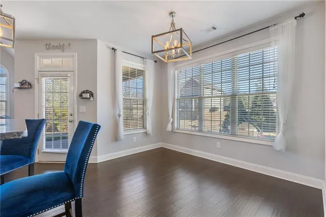 a view of livingroom with furniture wooden floor and windows