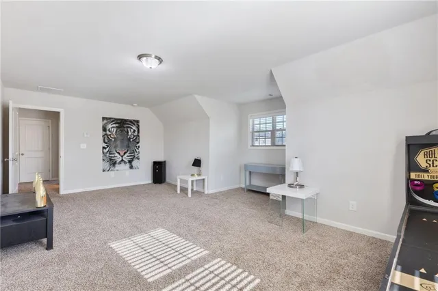a bathroom with a sink double vanity granite tub shower and a mirror