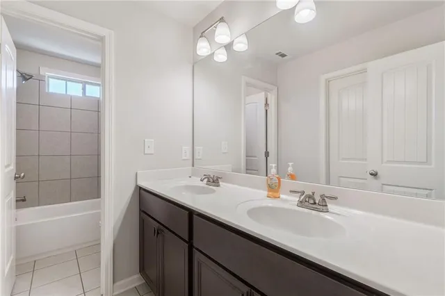 a bathroom with a toilet and bathtub