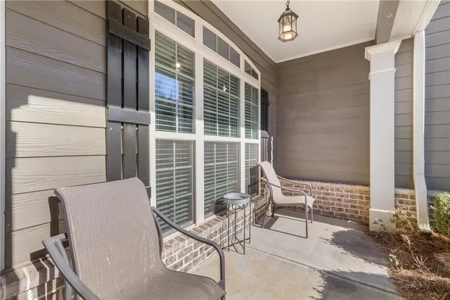 a view of a chair and table in the balcony