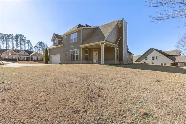 a view of a house with a yard
