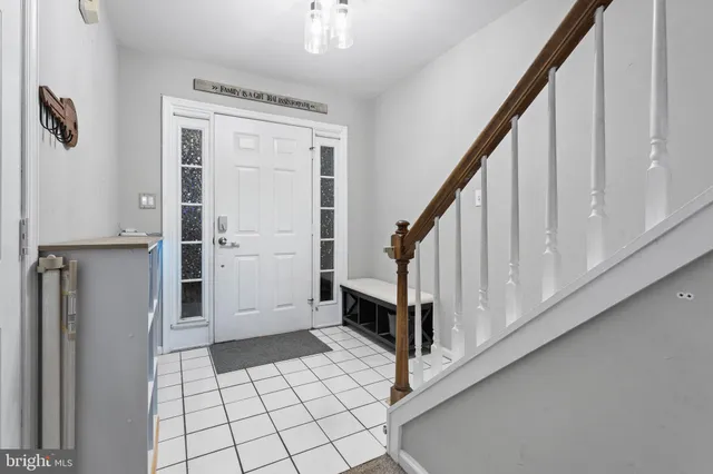 a view of staircase with white walls and window