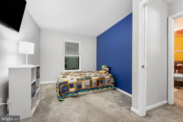 a room with bed and a window