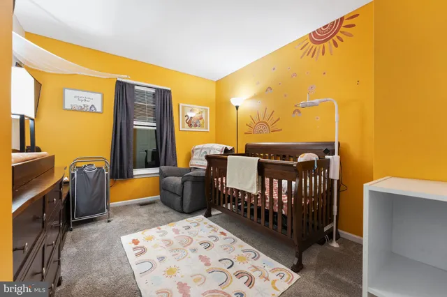 a bedroom with a bed and furniture