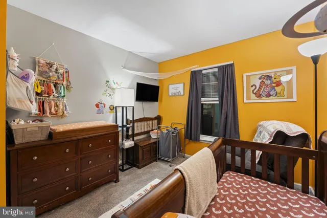 a bathroom with a sink a toilet and shower curtain