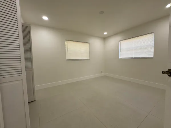 en empty room with windows