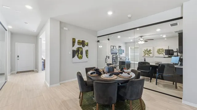 a kitchen with stainless steel appliances granite countertop a sink refrigerator and cabinets