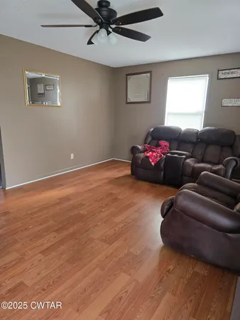 a living room with furniture and a window