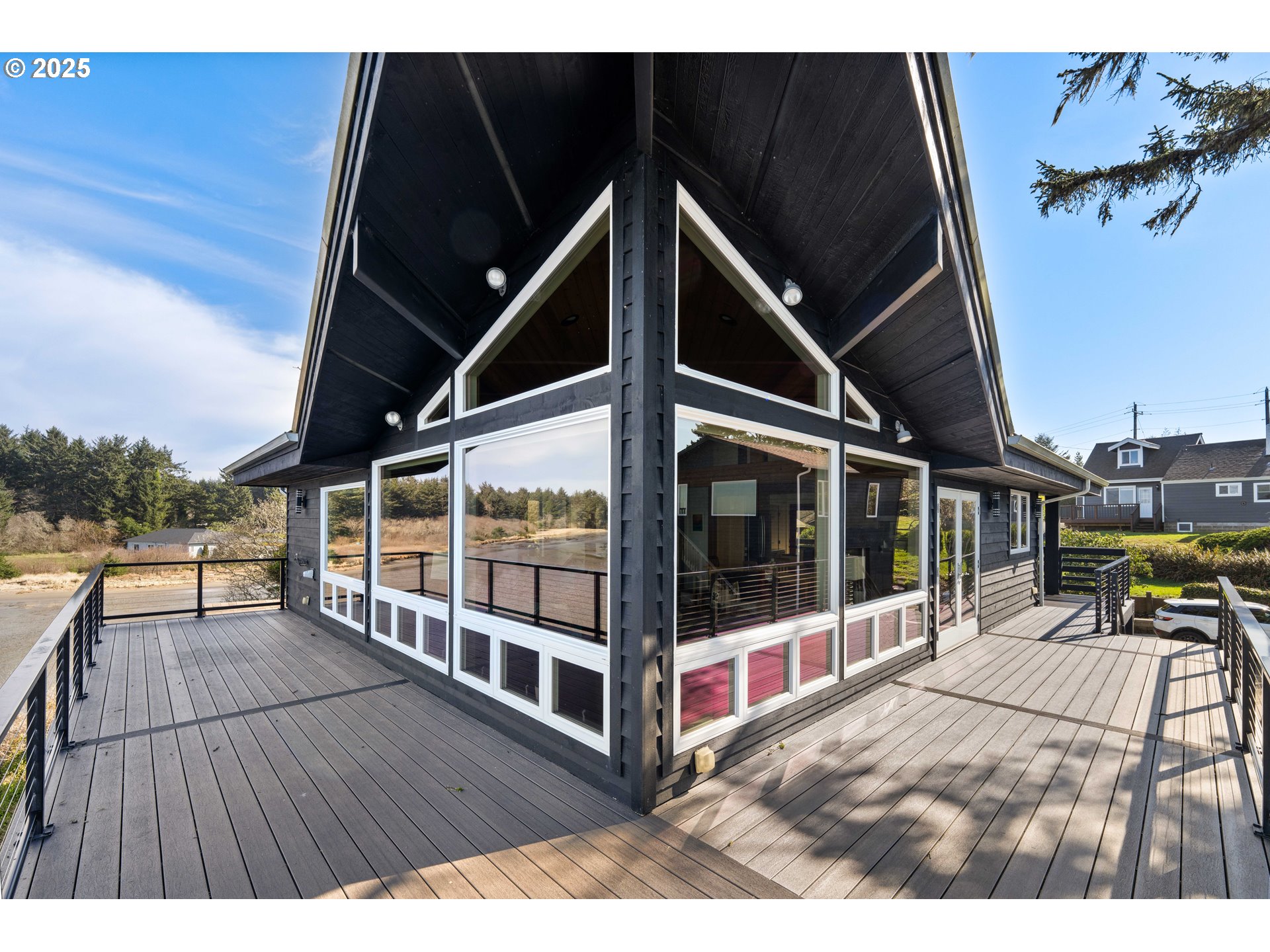 90989 Pigeon Point Loop Coos Bay, OR 97420 - Photo 15 of 48 a view of a balcony with wooden floor