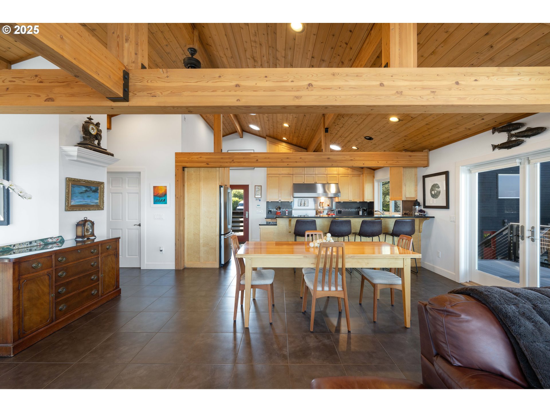 90989 Pigeon Point Loop Coos Bay, OR 97420 - Photo 17 of 48 a living room with stainless steel appliances kitchen island granite countertop furniture and a couch