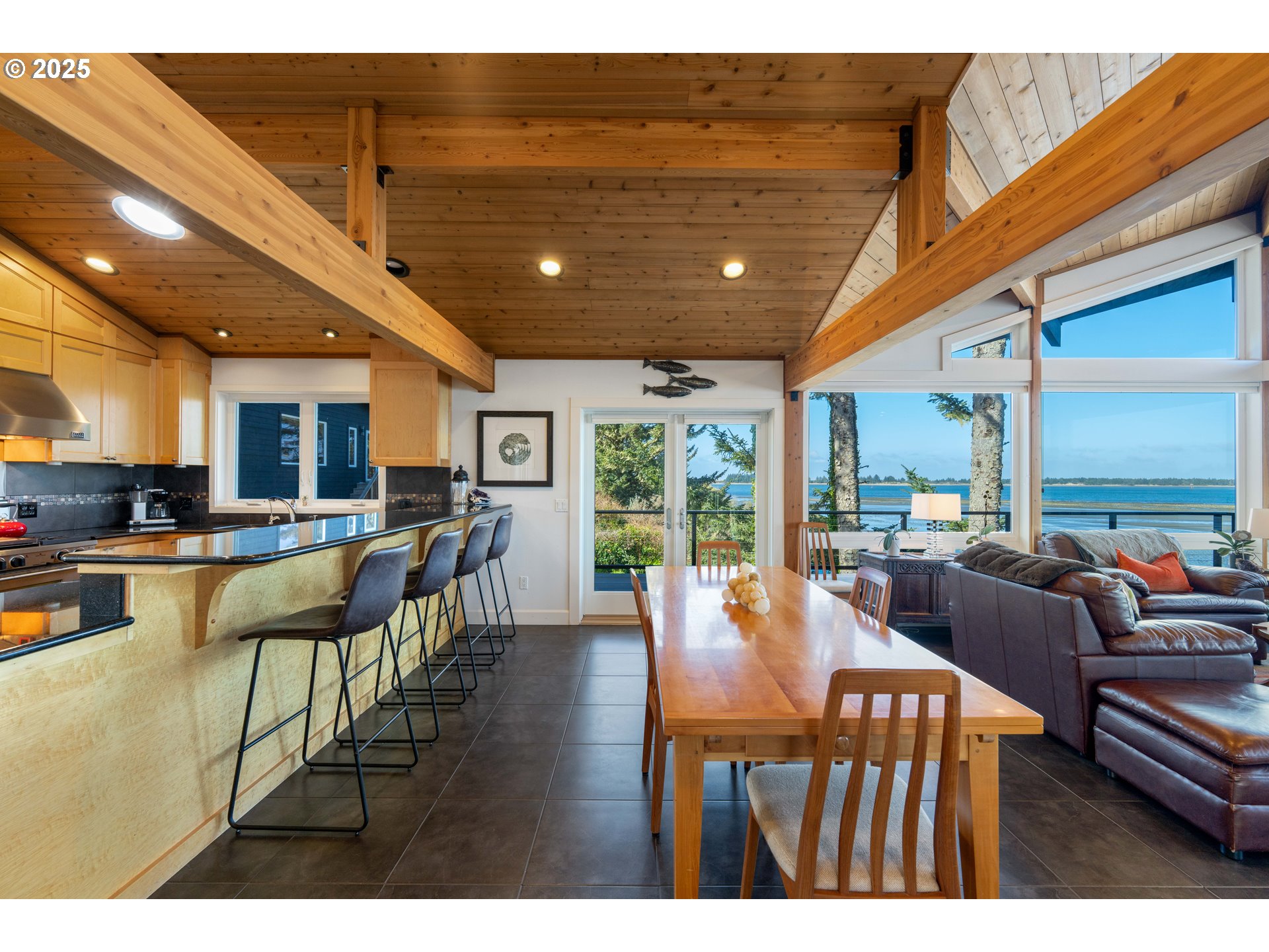 90989 Pigeon Point Loop Coos Bay, OR 97420 - Photo 18 of 48 a view of a dining room with furniture window and outside view