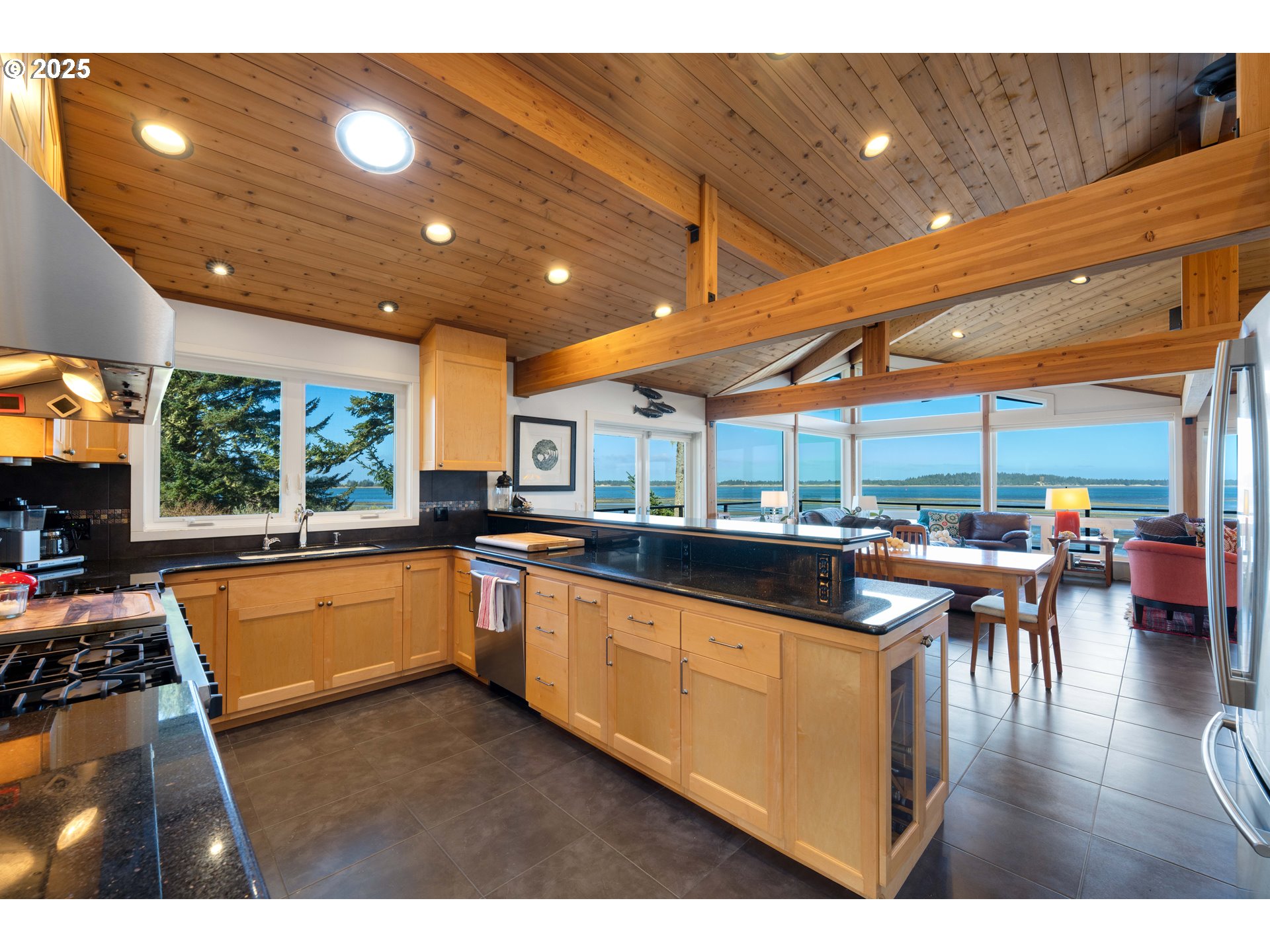 90989 Pigeon Point Loop Coos Bay, OR 97420 - Photo 21 of 48 a kitchen with stainless steel appliances granite countertop a sink and cabinets