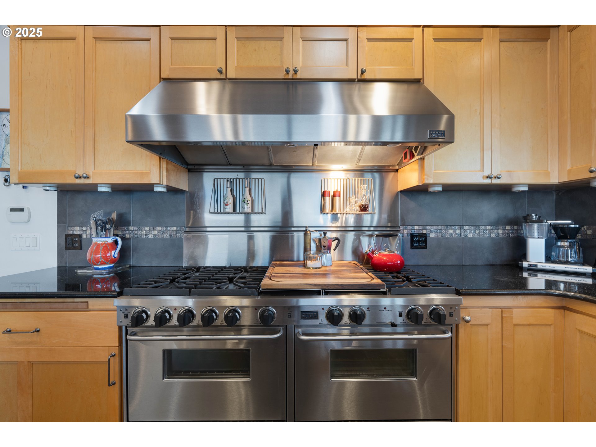 90989 Pigeon Point Loop Coos Bay, OR 97420 - Photo 22 of 48 a kitchen with stainless steel appliances granite countertop a stove and a refrigerator
