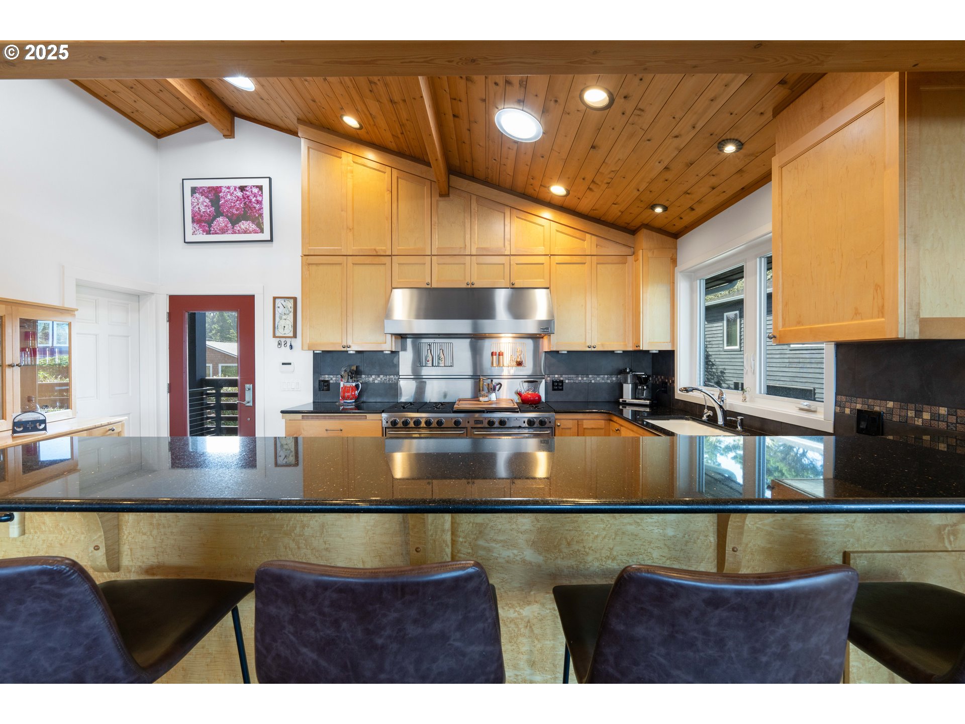 90989 Pigeon Point Loop Coos Bay, OR 97420 - Photo 24 of 48 a kitchen with kitchen island a counter top space a sink and window