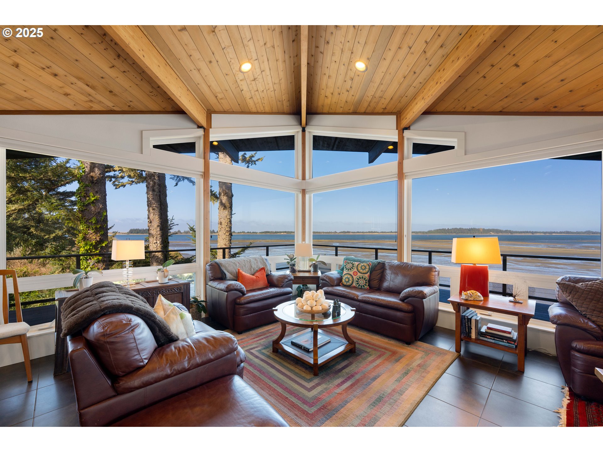 90989 Pigeon Point Loop Coos Bay, OR 97420 - Photo 25 of 48 a living room with furniture a rug and a large window