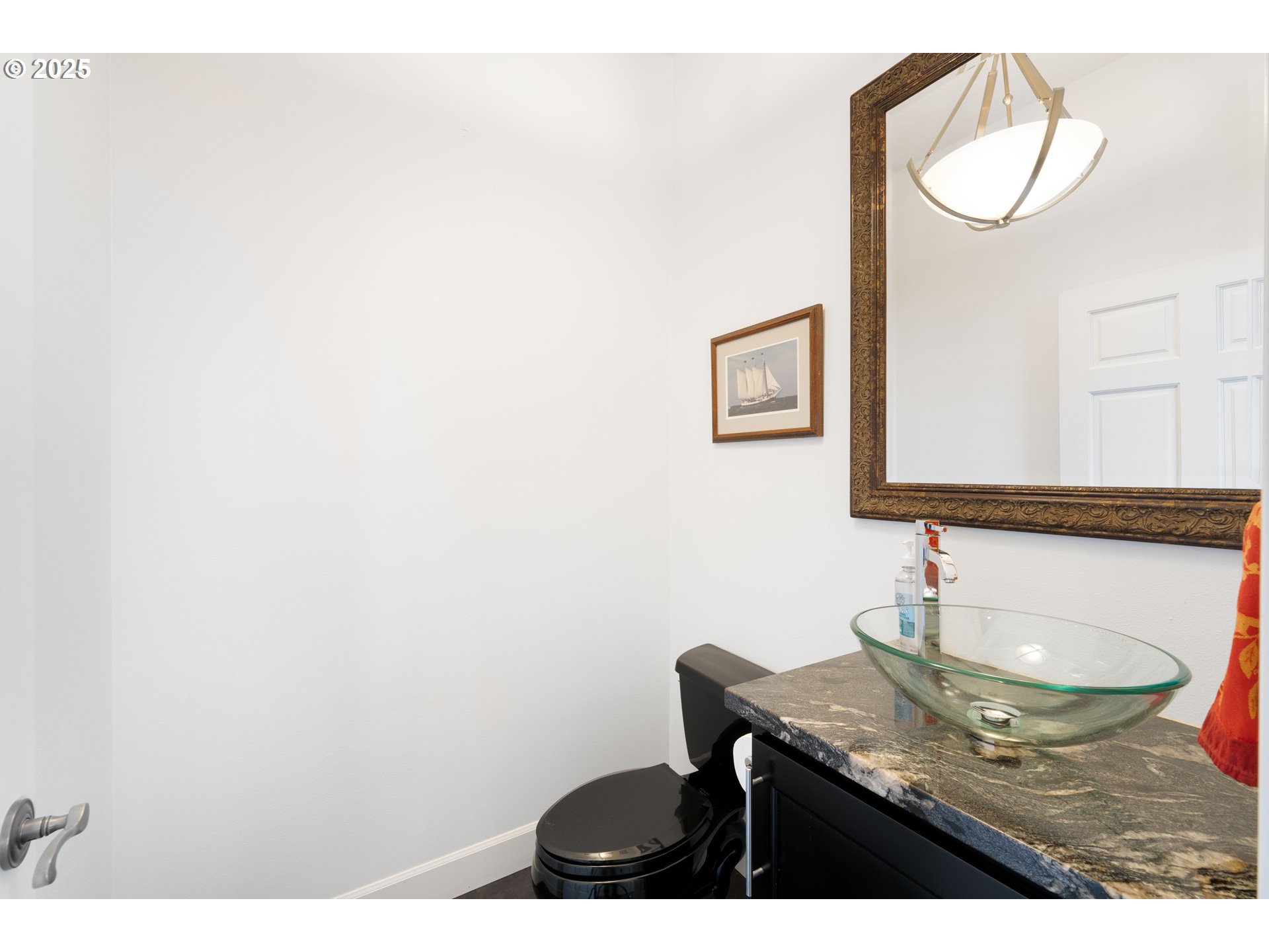90989 Pigeon Point Loop Coos Bay, OR 97420 - Photo 30 of 48 a bathroom with a granite countertop sink and a mirror