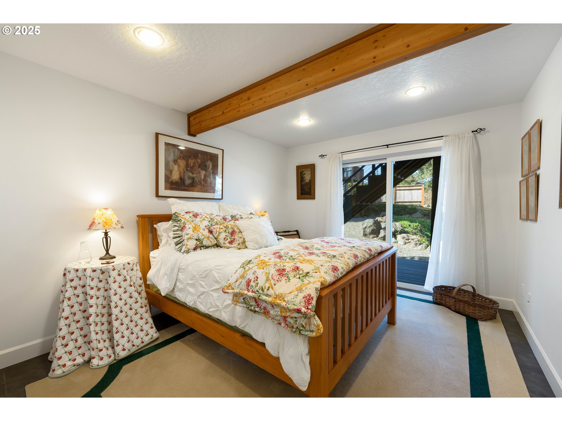 90989 Pigeon Point Loop Coos Bay, OR 97420 - Photo 32 of 48 a bedroom with a bed window and a night stand