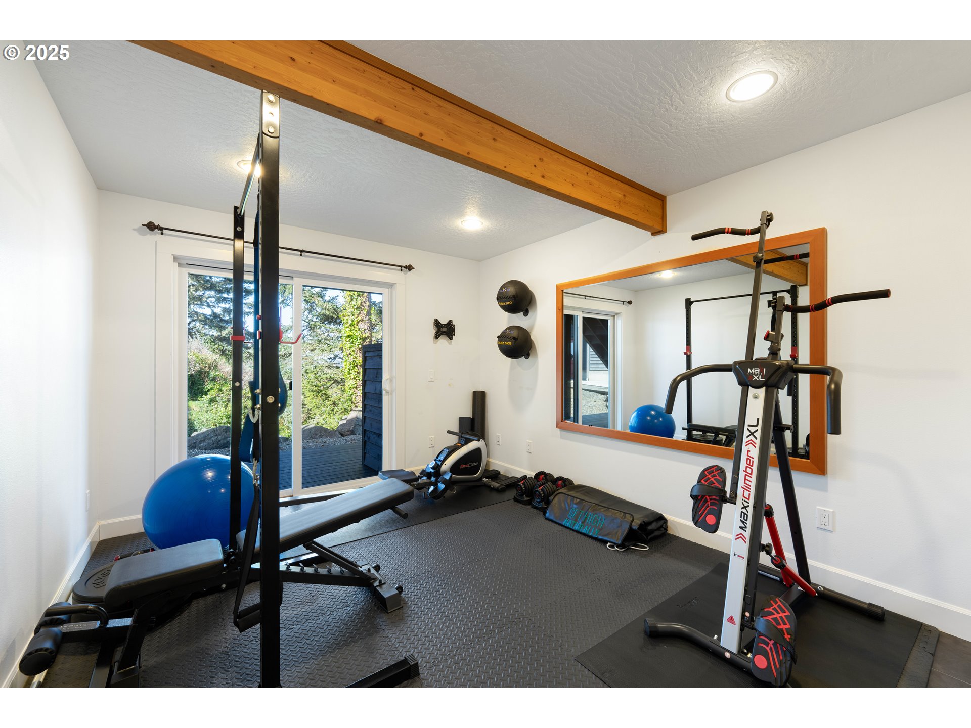 90989 Pigeon Point Loop Coos Bay, OR 97420 - Photo 34 of 48 a room with gym equipment and a large window