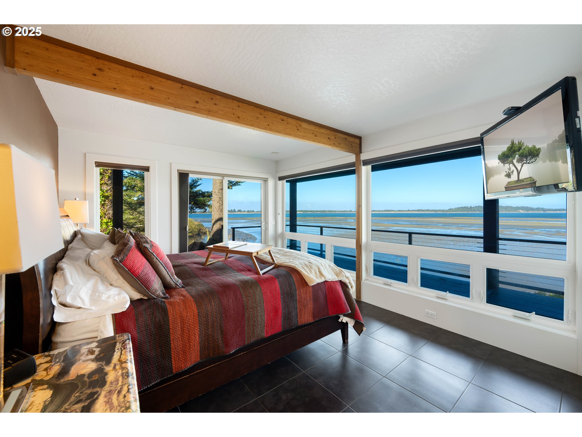 90989 Pigeon Point Loop Coos Bay, OR 97420 - Photo 35 of 48 a bedroom with a bed and large window