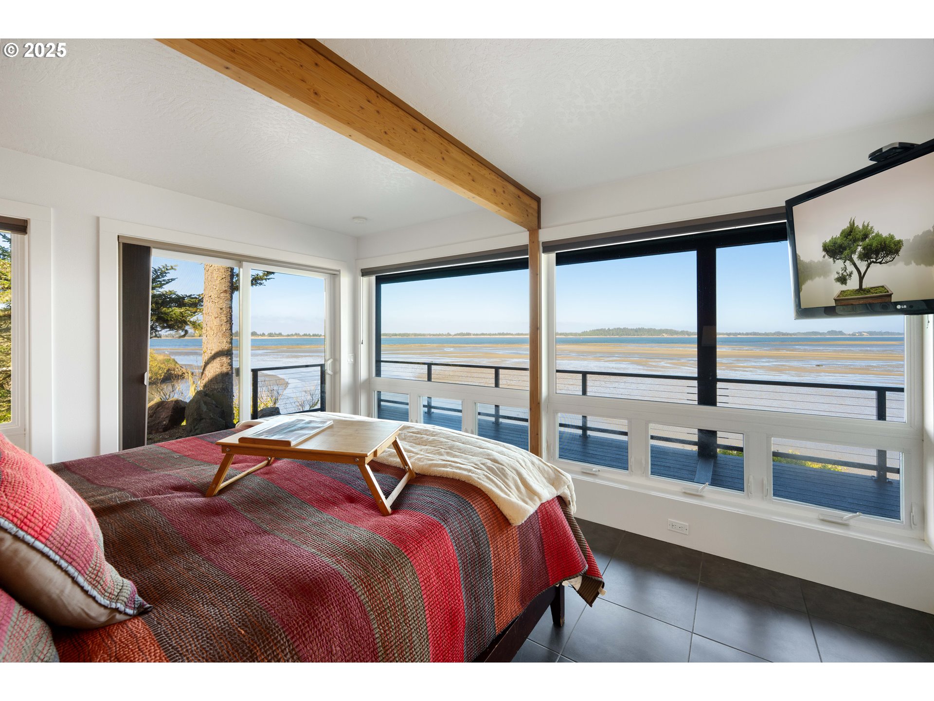 90989 Pigeon Point Loop Coos Bay, OR 97420 - Photo 36 of 48 a bedroom with a large bed and a large window