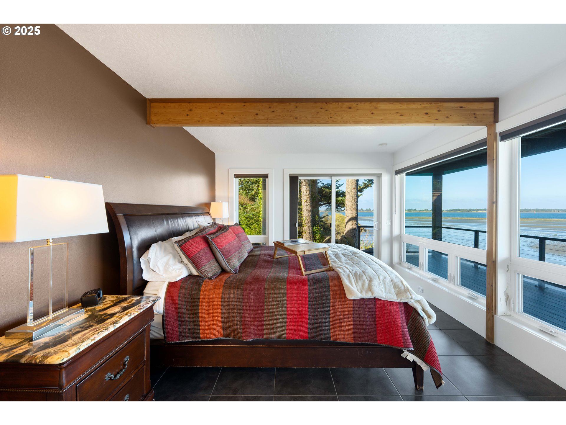 90989 Pigeon Point Loop Coos Bay, OR 97420 - Photo 37 of 48 a bed sitting in a bedroom next to a window