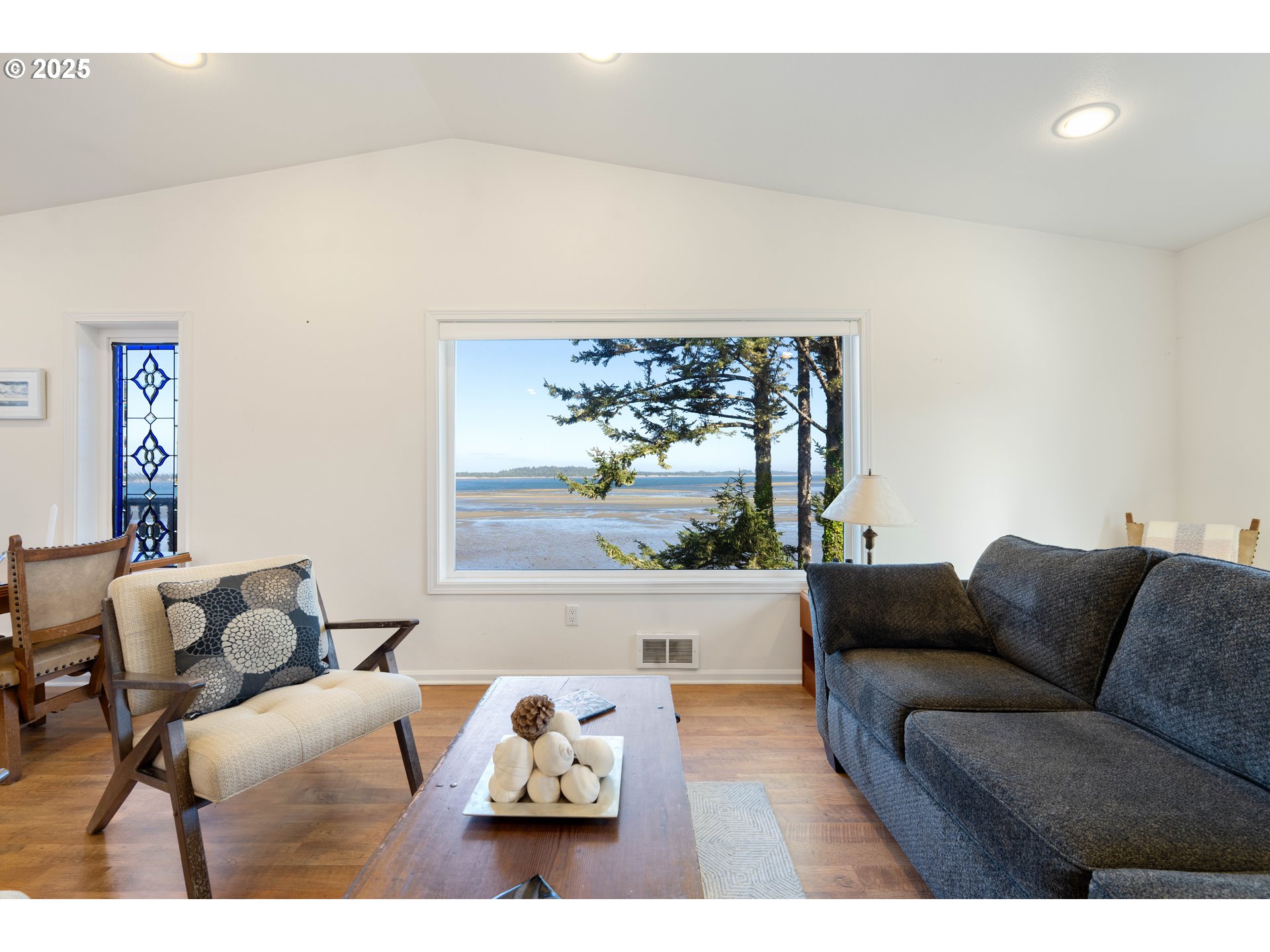 90989 Pigeon Point Loop Coos Bay, OR 97420 - Photo 44 of 48 a living room with furniture and a large window