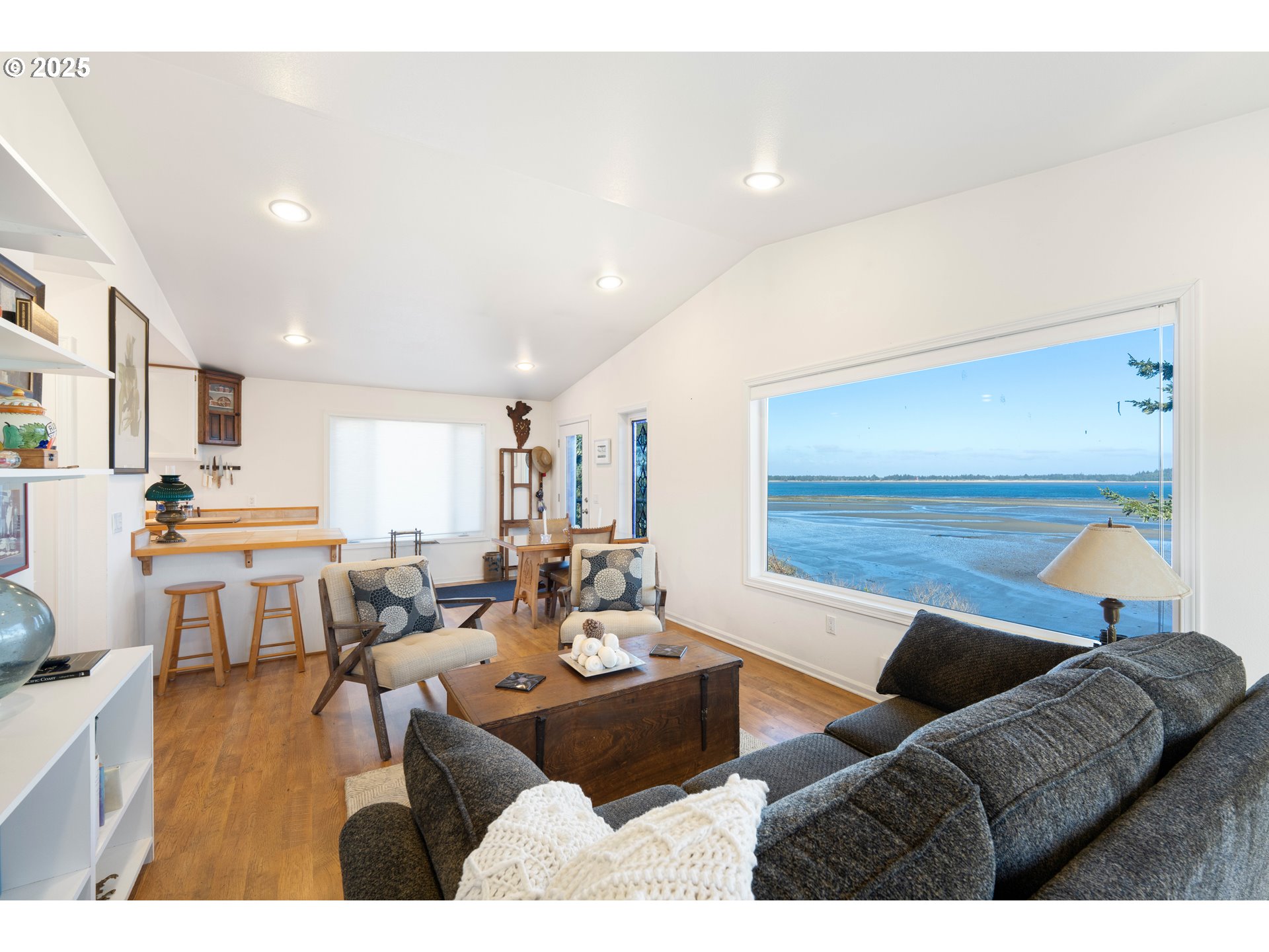 90989 Pigeon Point Loop Coos Bay, OR 97420 - Photo 45 of 48 a living room with furniture kitchen view and a large window