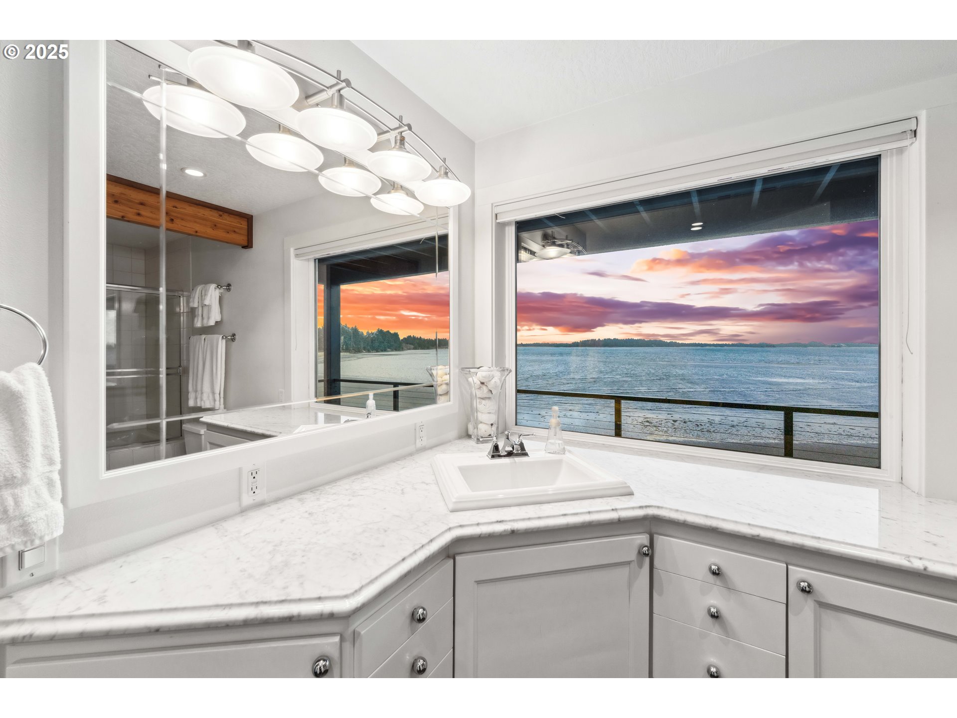 90989 Pigeon Point Loop Coos Bay, OR 97420 - Photo 6 of 48 a bathroom with a sink and a large mirror