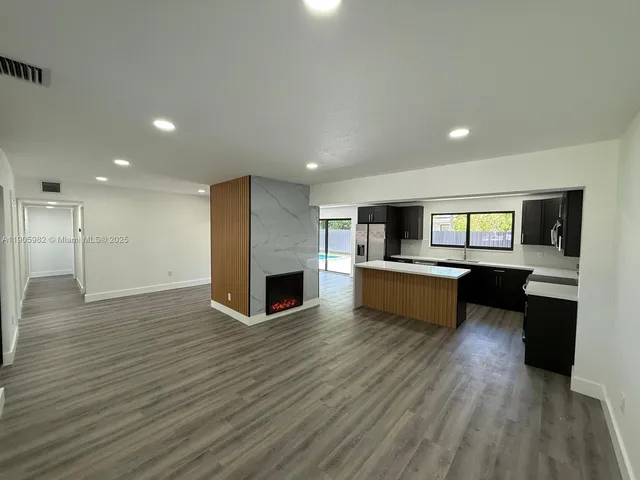a view of kitchen with microwave and stove