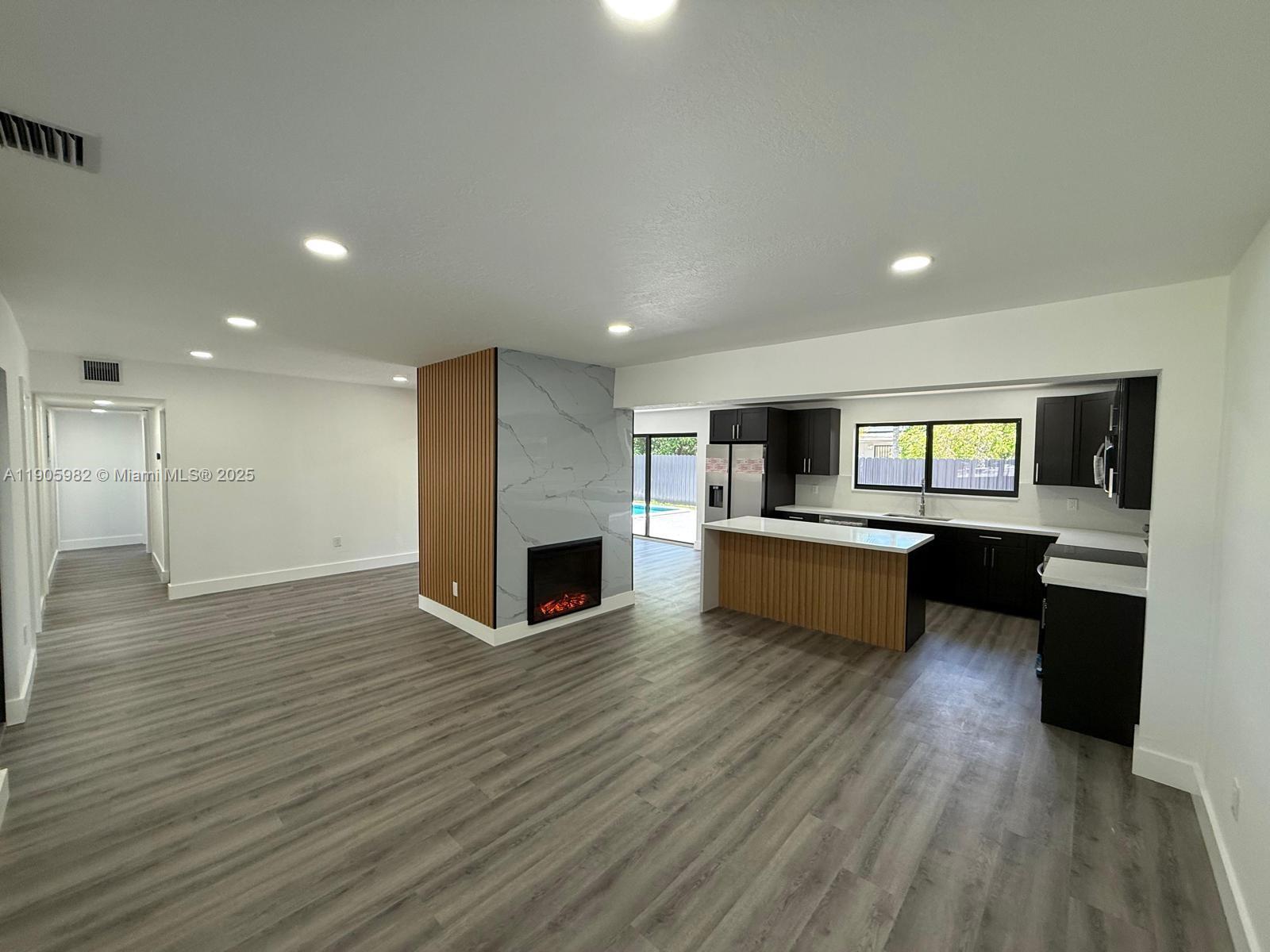 20 Northwest 197th Street Miami Gardens, FL 33169 - Photo 14 of 48 a view of kitchen with microwave and stove