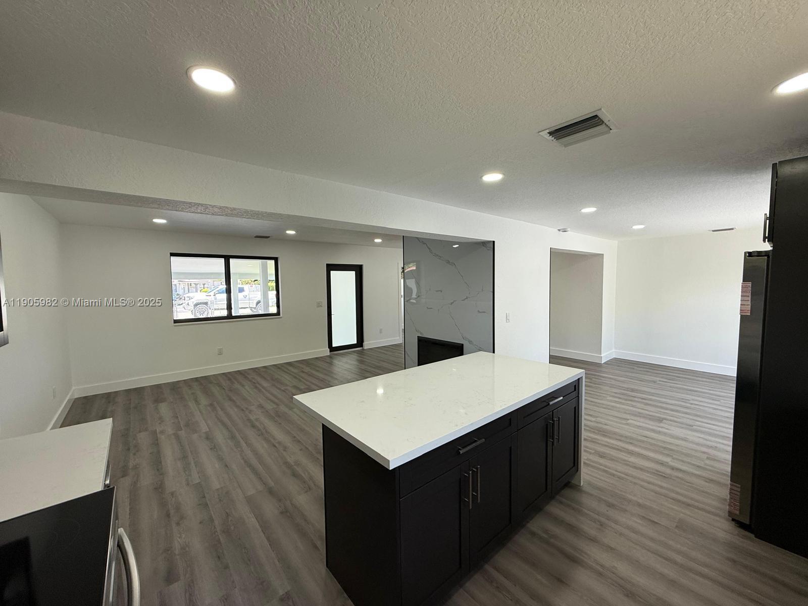 20 Northwest 197th Street Miami Gardens, FL 33169 - Photo 20 of 48 a living room with a wooden floor