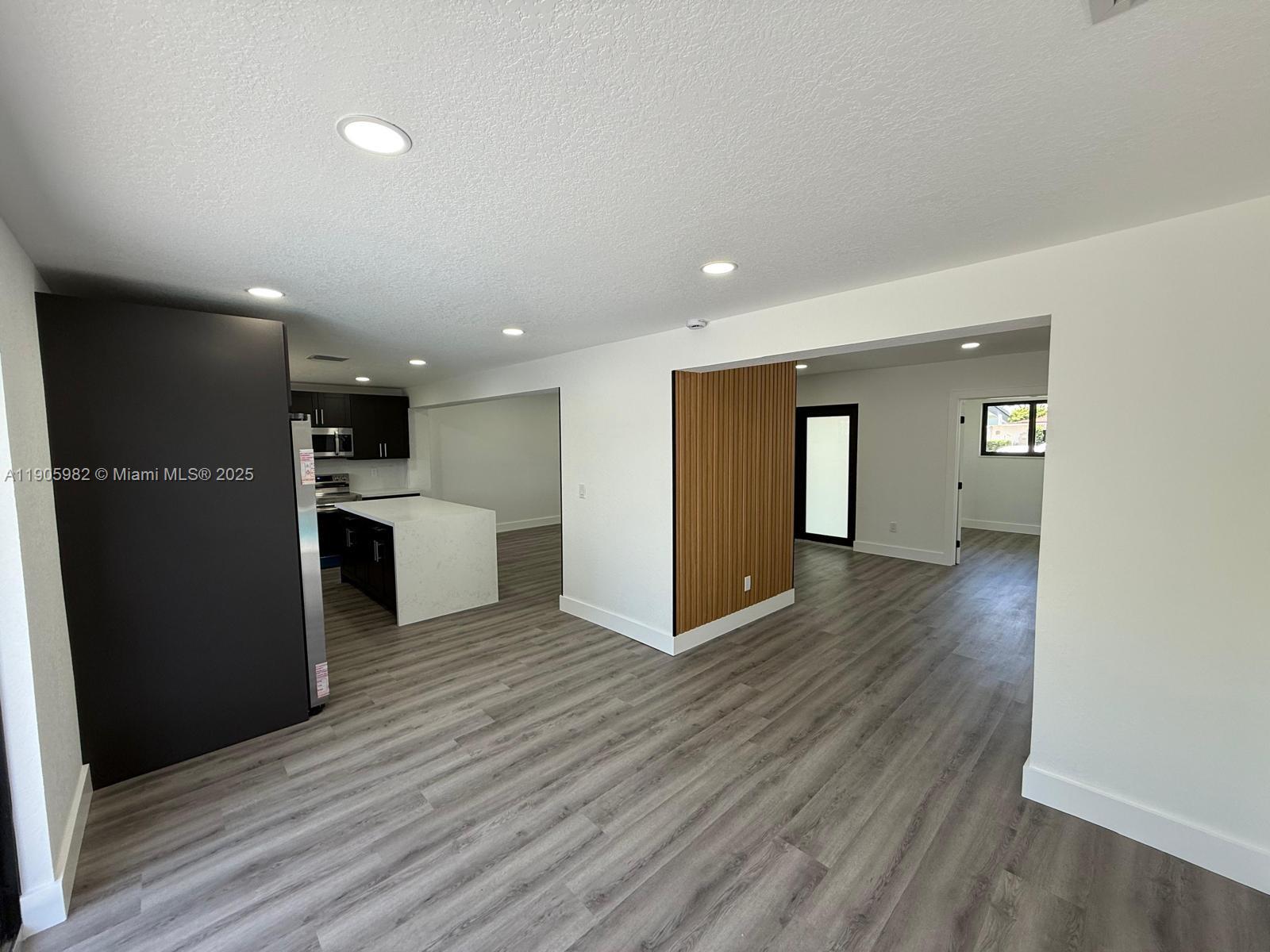 20 Northwest 197th Street Miami Gardens, FL 33169 - Photo 21 of 48 a view of kitchen with refrigerator and microwave
