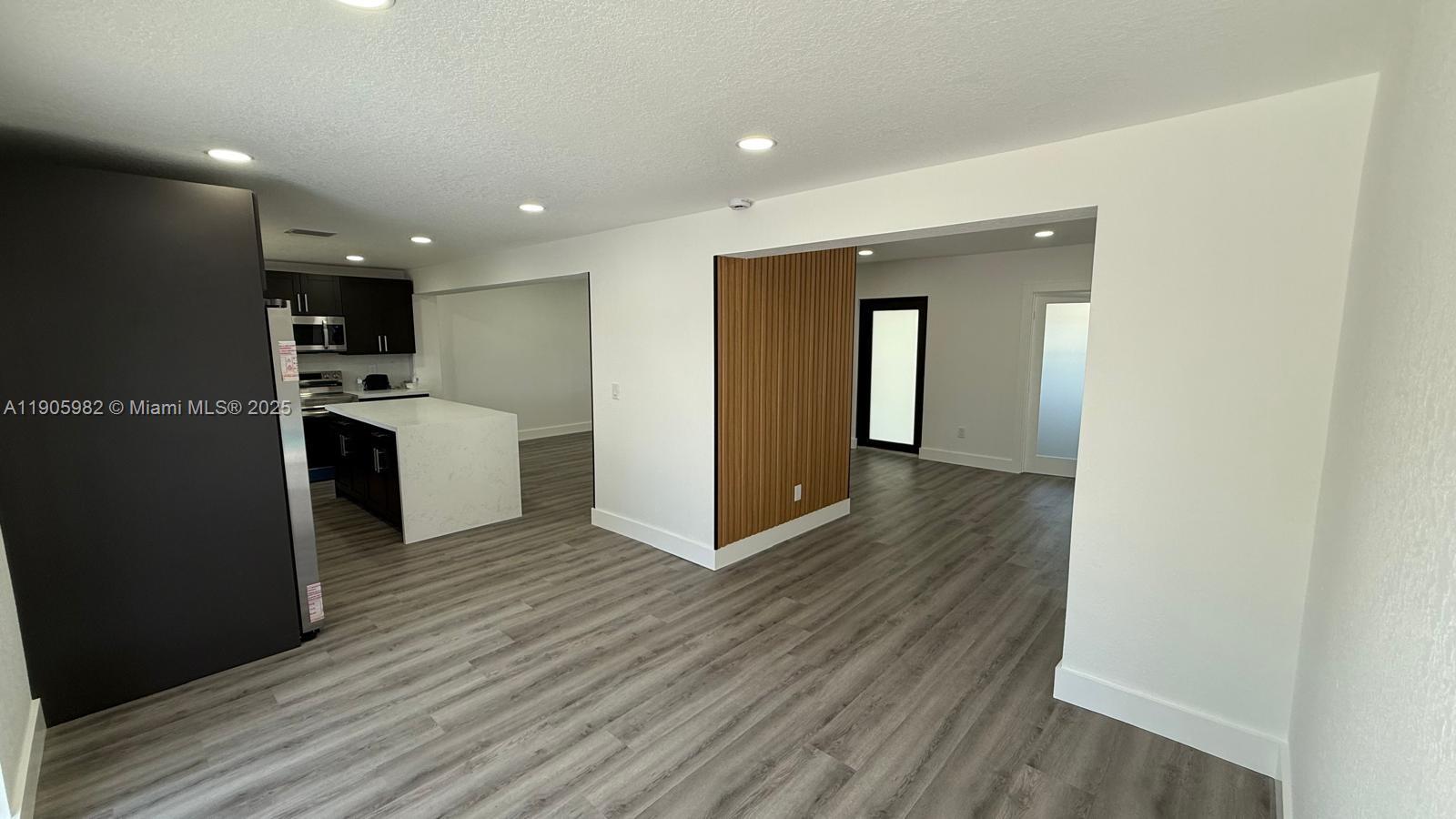 20 Northwest 197th Street Miami Gardens, FL 33169 - Photo 23 of 48 a view of a kitchen from the hallway