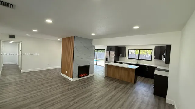 a view of living room with furniture and fireplace