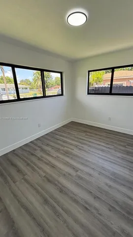 a view of an empty room and window