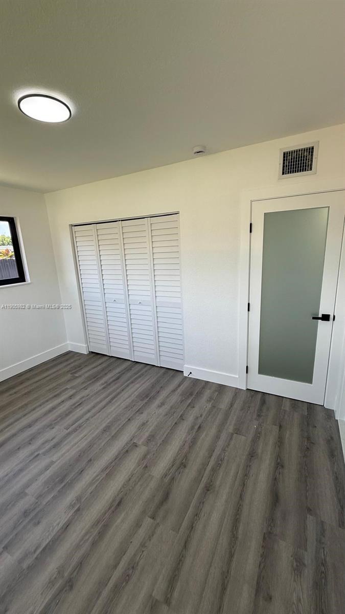 20 Northwest 197th Street Miami Gardens, FL 33169 - Photo 33 of 48 a view of an empty room and wooden floor