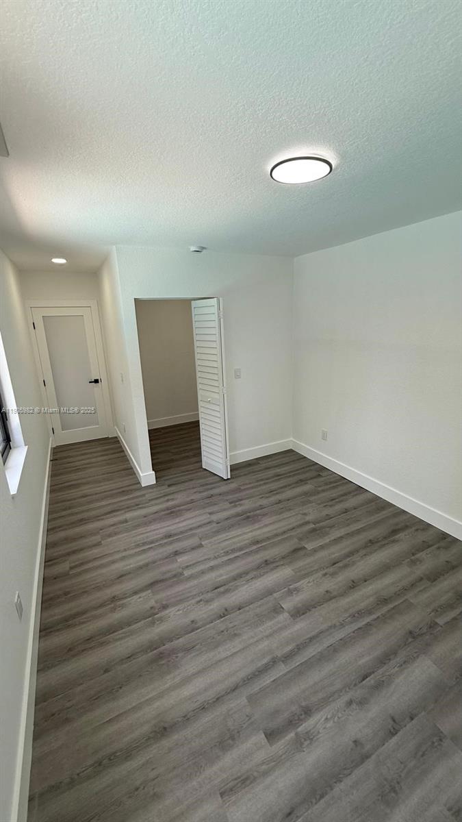 20 Northwest 197th Street Miami Gardens, FL 33169 - Photo 37 of 48 wooden floor in an empty room
