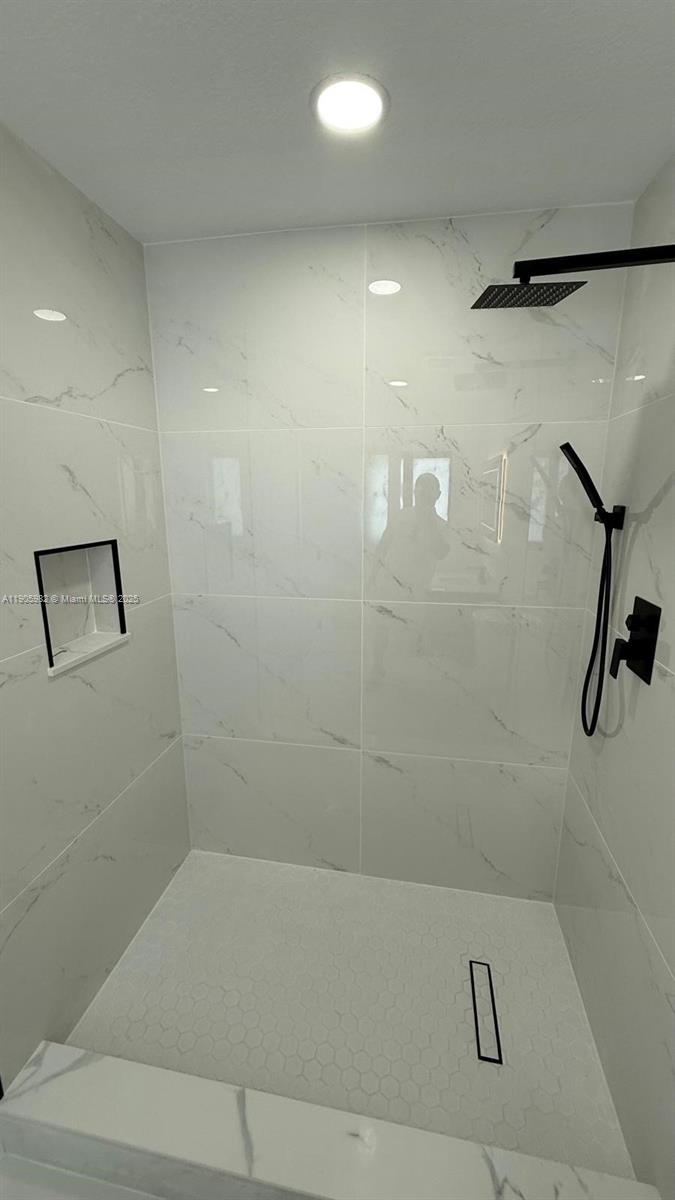 20 Northwest 197th Street Miami Gardens, FL 33169 - Photo 40 of 48 a bathroom with a shower