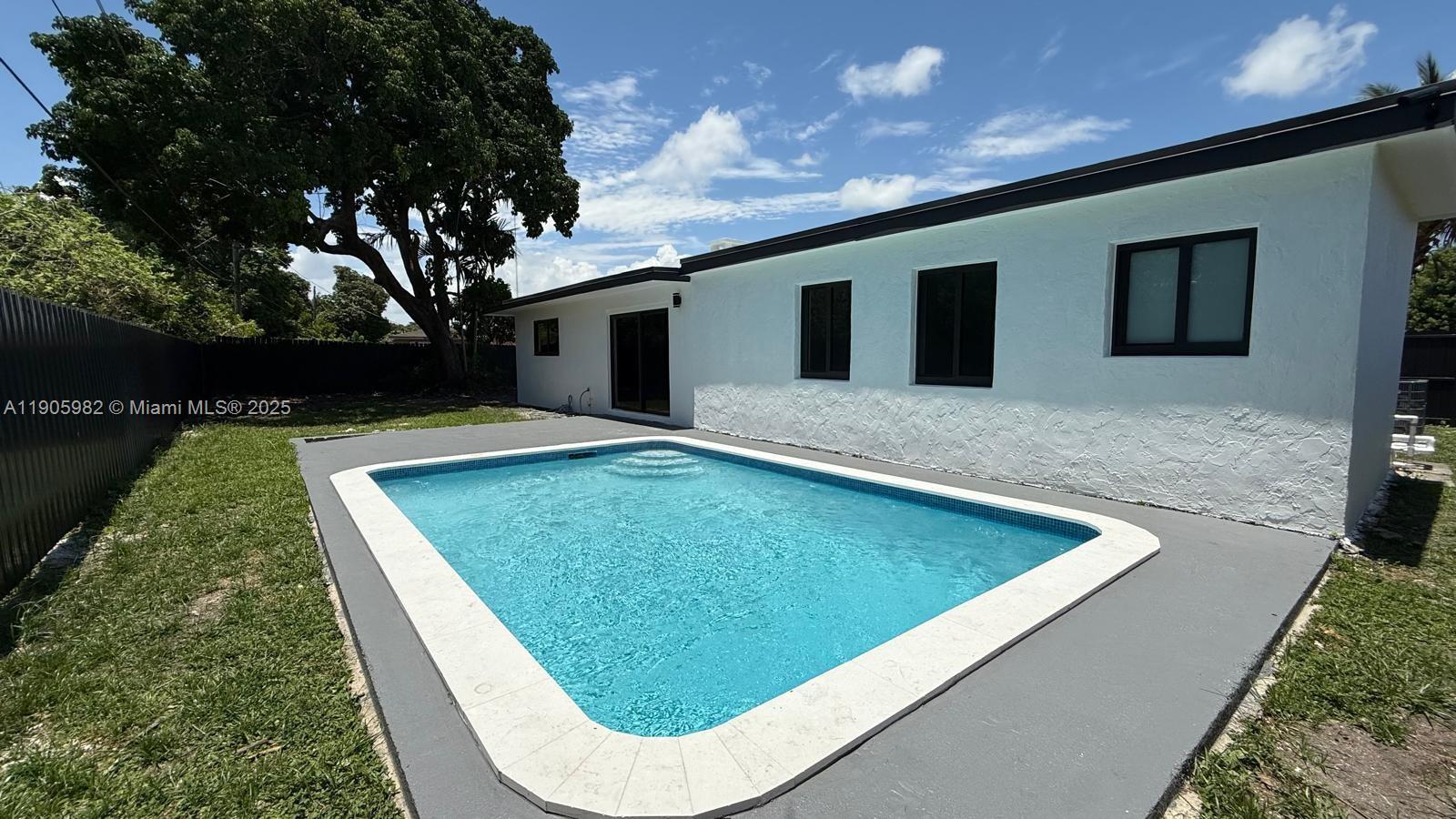 20 Northwest 197th Street Miami Gardens, FL 33169 - Photo 10 of 48 a view of swimming pool with a backyard