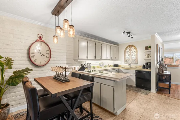 a view of a dining room and kitchen
