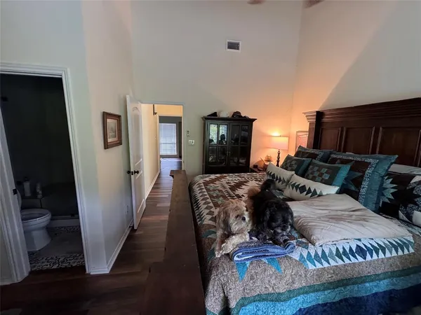 a bed room with a bed window and a television