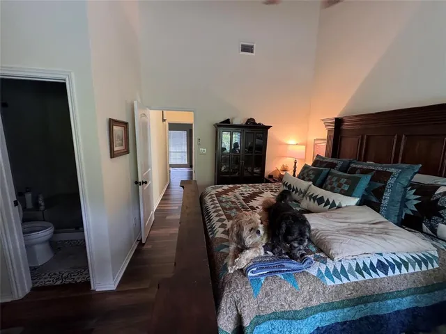 a bed room with a bed window and a television